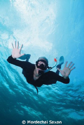 Taken at Stingray City.  I was photographing the rays, on... by Mordechai Saxon 
